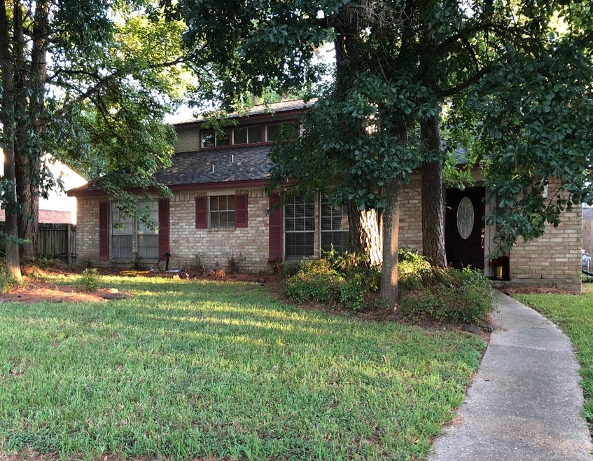 Welcome Home! Beautiful mature trees shade the hom