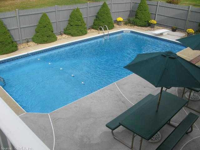 Pool. Large yard behind fenced in pool area.
