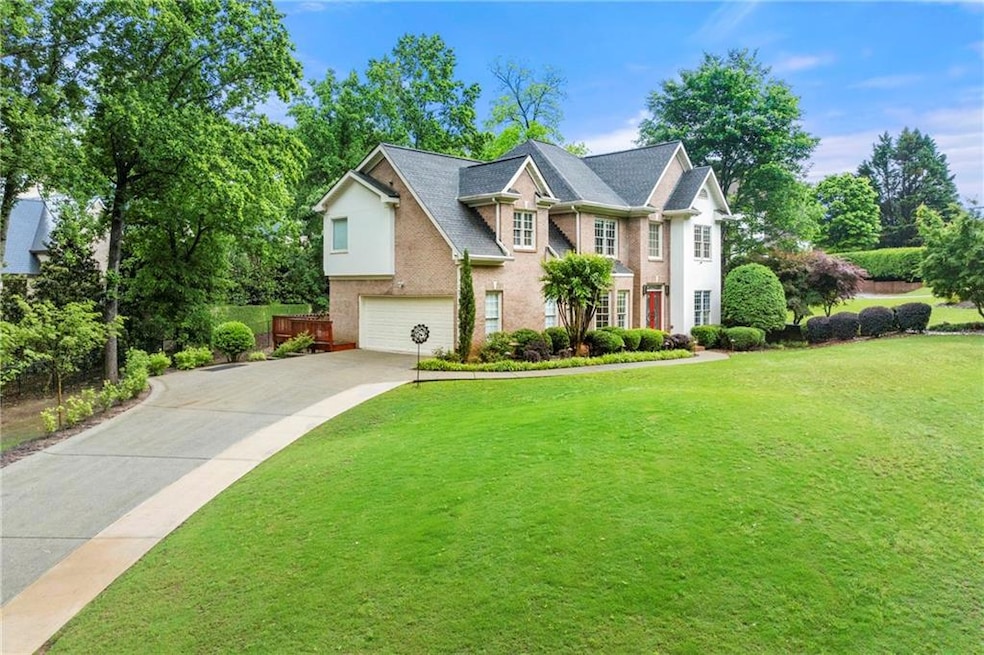 View of front of property featuring a garage and d