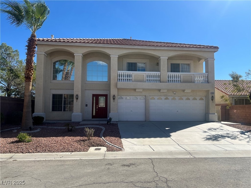 Mediterranean / spanish-style house featuring stucco siding, concrete driveway, a tiled roof, and an attached garage
