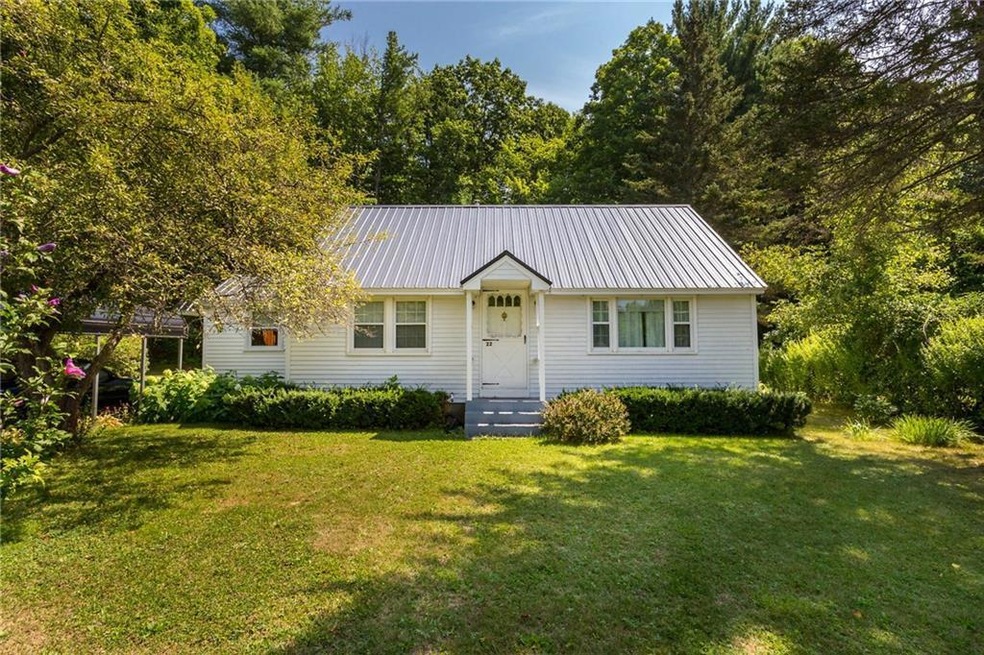 Front of this cape home with metal roof