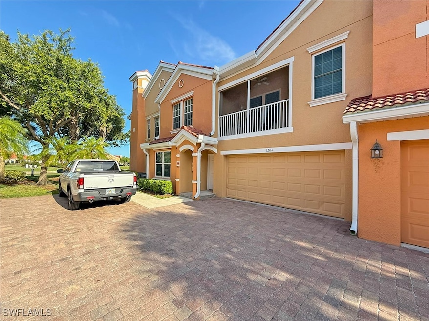 Multi unit property with stucco siding, a garage,