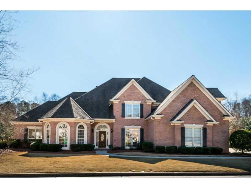 Exterior Front. 4 sides brick home with large yard