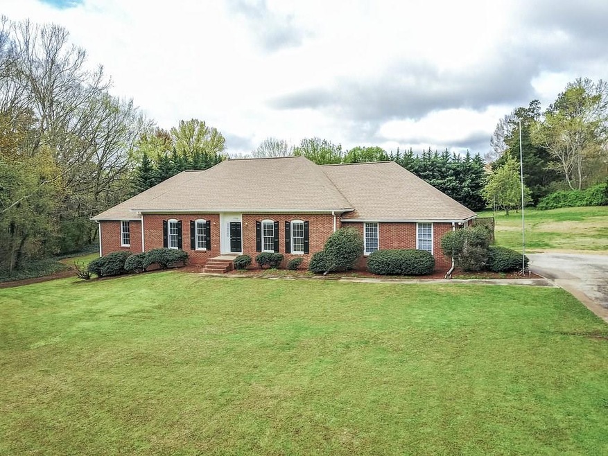 All Brick Ranch with Basement of 1.65 +/- Acres