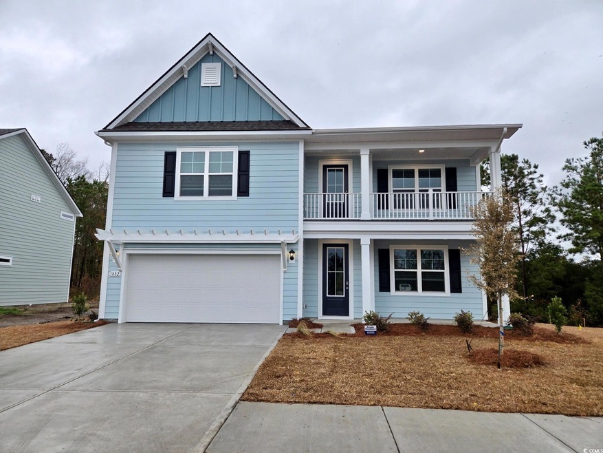 View of front of property featuring a garage and a