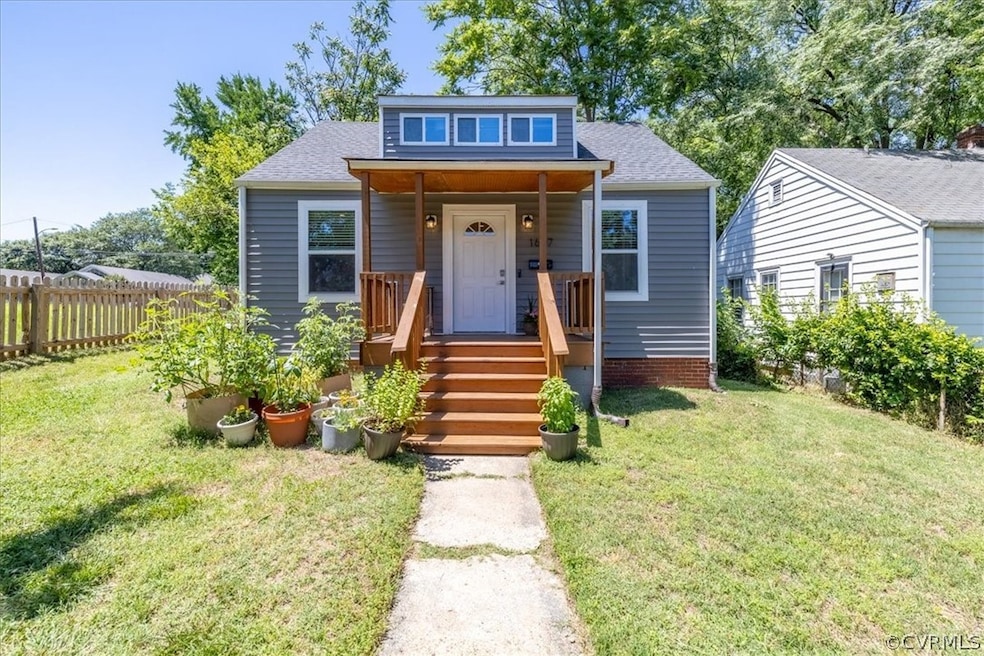 Bungalow-style home with a front yard