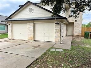 Garage featuring driveway