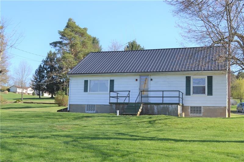 4 bedroom 2 bath home with new steel roof on 1.966