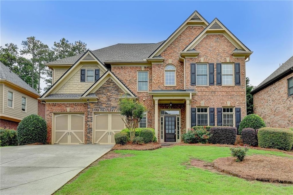 Craftsman-style home with a garage and a front yar