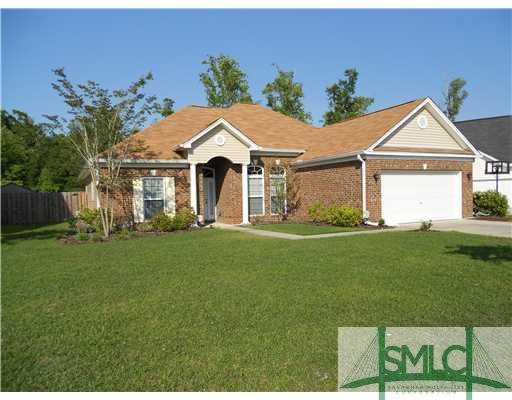 Exterior Front. Nice landscaping and large front y