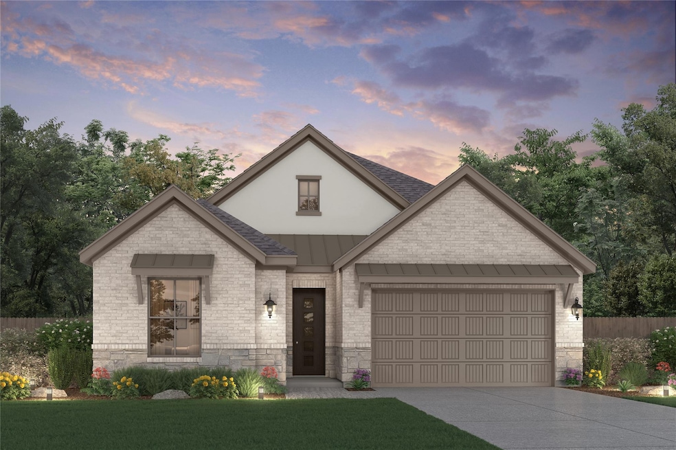French country inspired facade featuring an attac