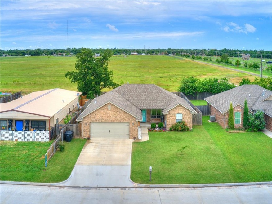 This beautiful home backs to an open field and is 