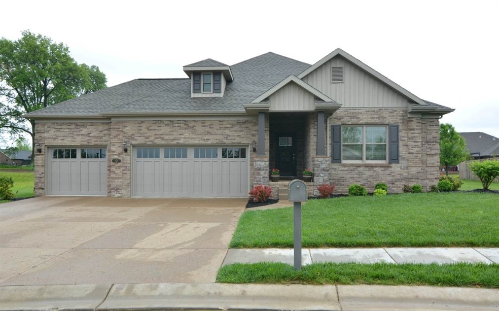 Three car garage and extra wide driveway.