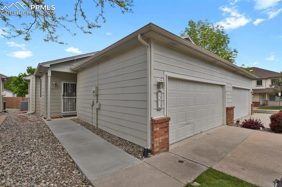 View  of home featuring central AC unit 2 car attached garage