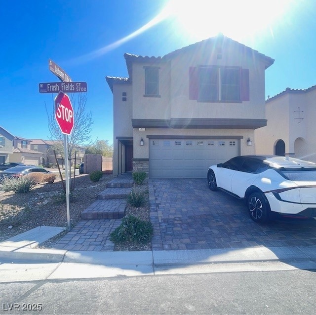 View of front of property with decorative driveway