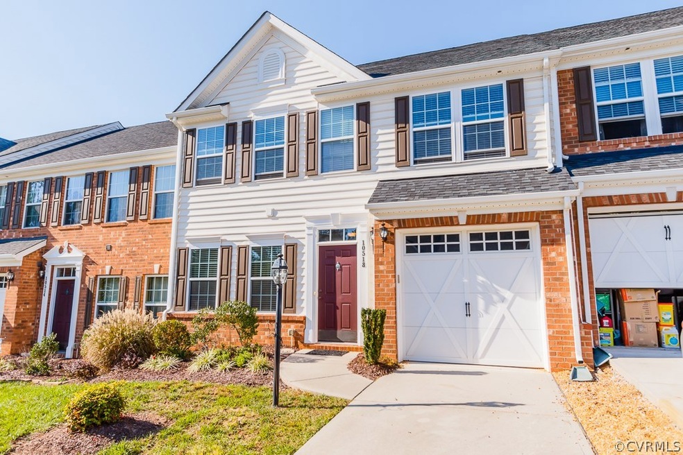 FRONT EXTERIOR W/ ATTACHED GARAGE, PAVED DRIVEWAY,