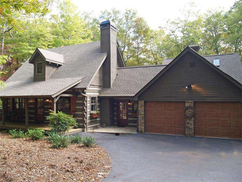 Beautiful log home sits way back off the property.