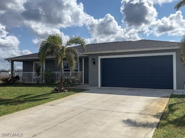 Ranch-style home featuring stucco siding, a garage