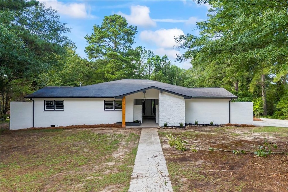 Mid-century inspired home with roof with shingles
