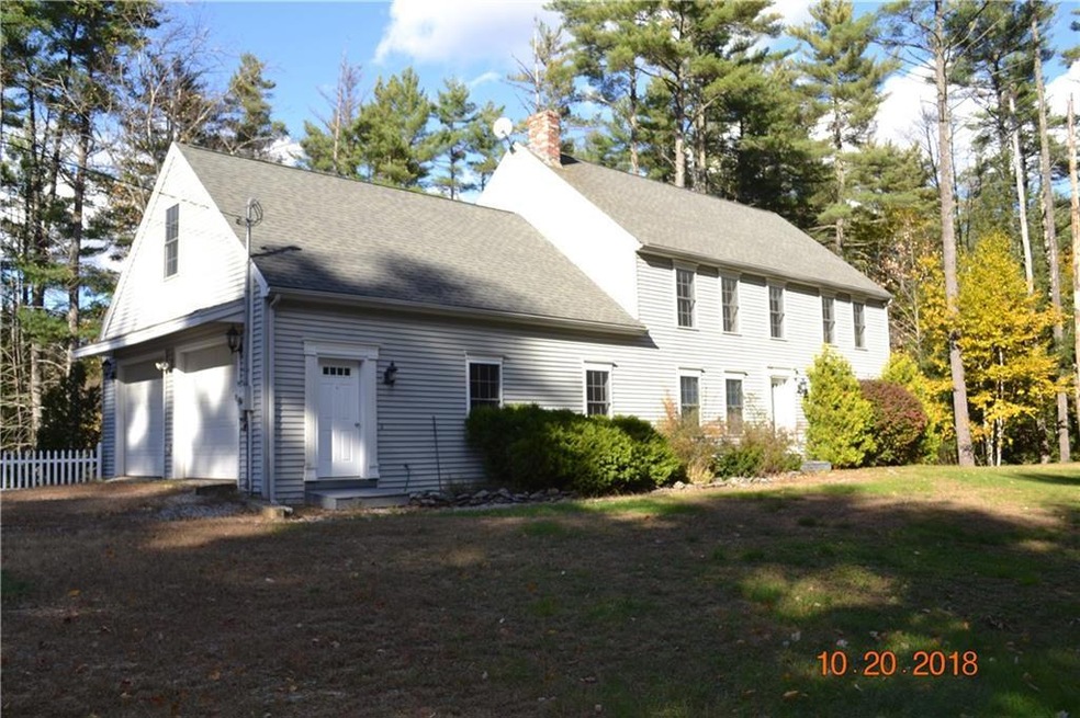 Driveway view of the home featuring...