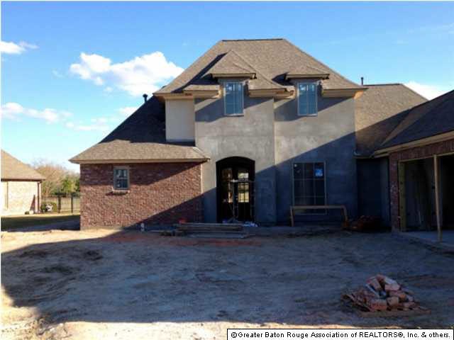 Street view of wonderful 4 bedroom/3 bath now under construction! Completion is on target for mid-June.