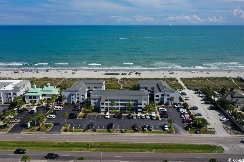 Aerial view featuring a beach view and a water vie