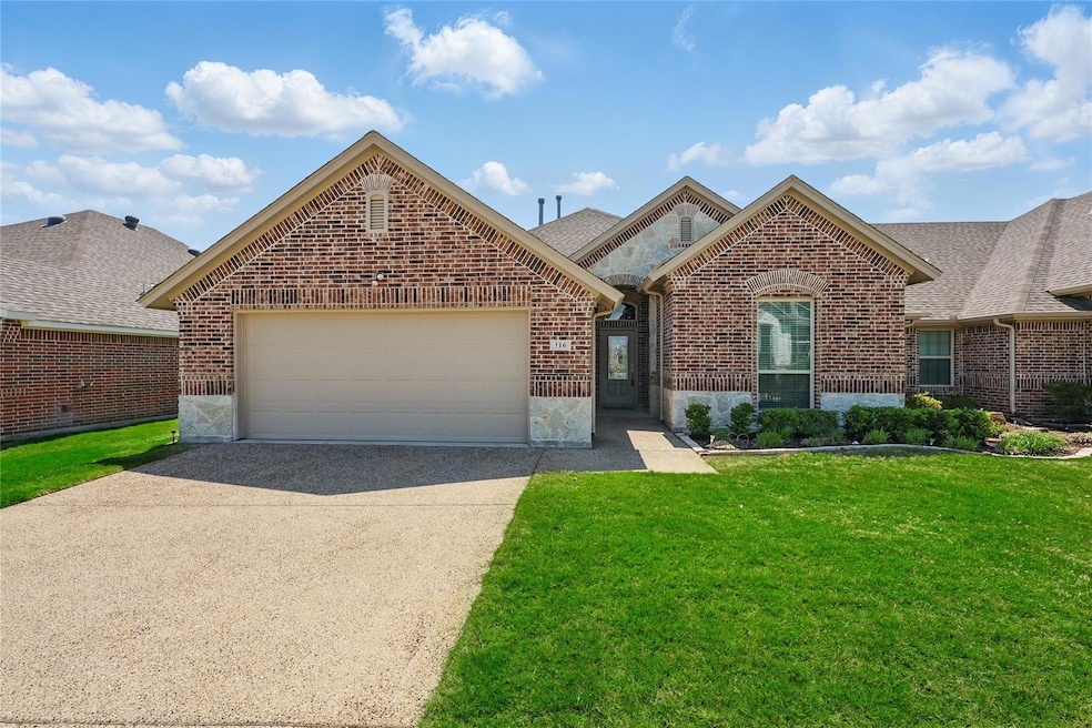 View of front of property featuring stone siding, 