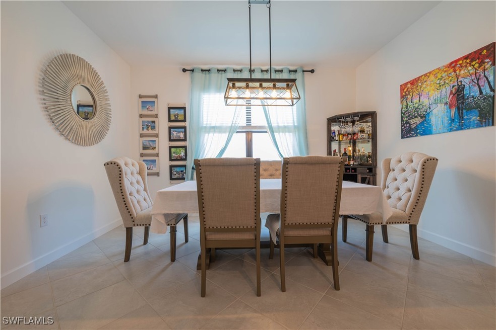 Dining room featuring baseboards and light tile pa