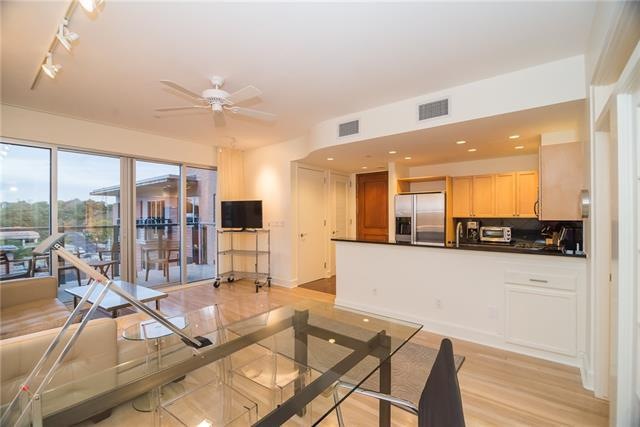 Light and bright with beautiful wood floors; moder