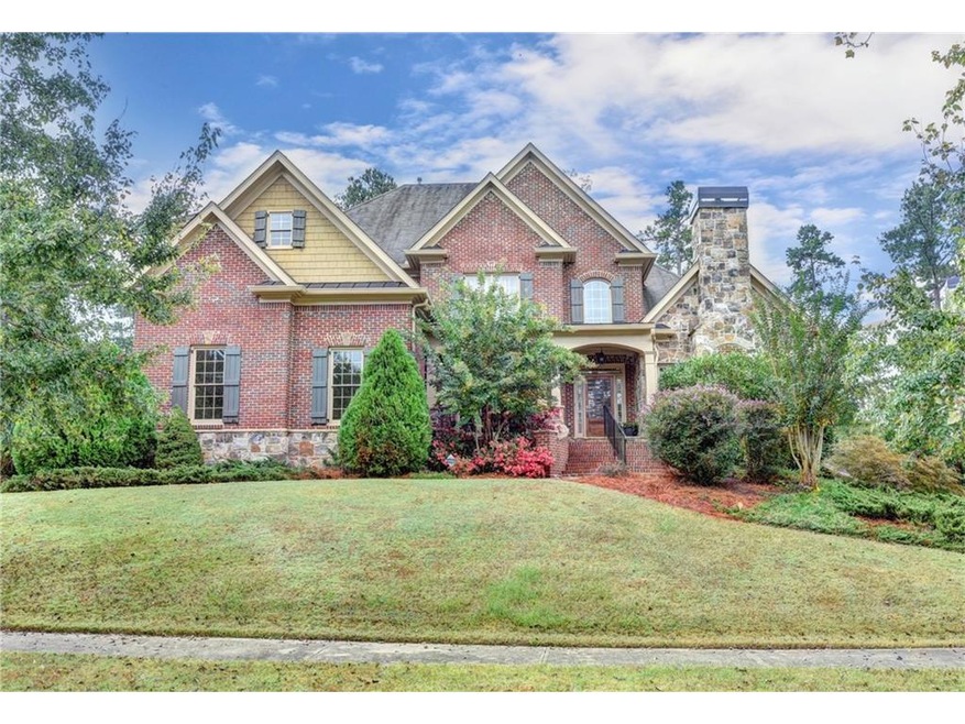 Gorgeous Brick and Stone Custom home with covered 