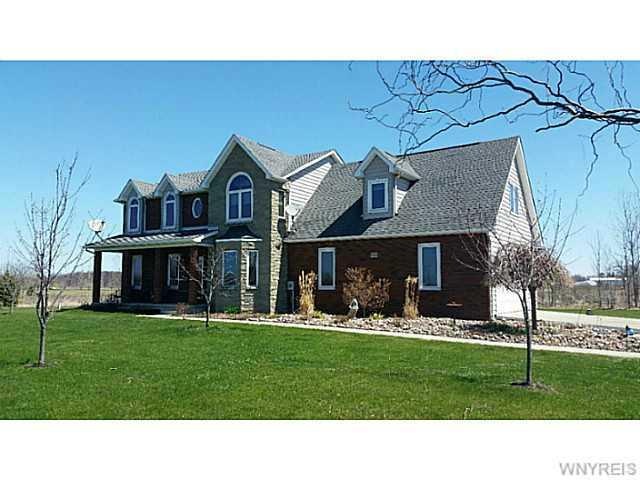 Exterior Front. 2.5 attached garage w/plenty of pa