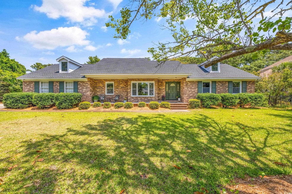 Ranch-style home with a front yard