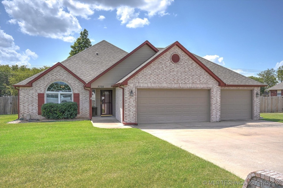 Front of home, faces east.