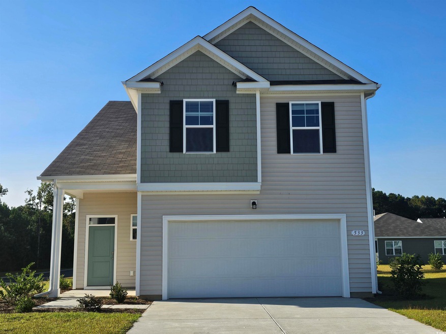 View of front facade with a garage
