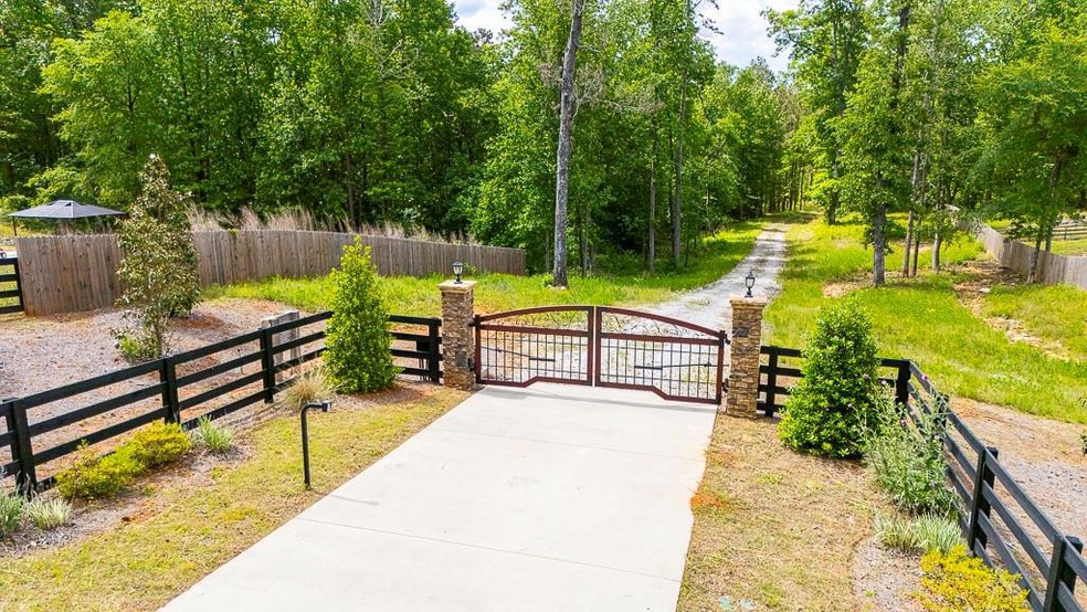 Front entrance with gate and fence.