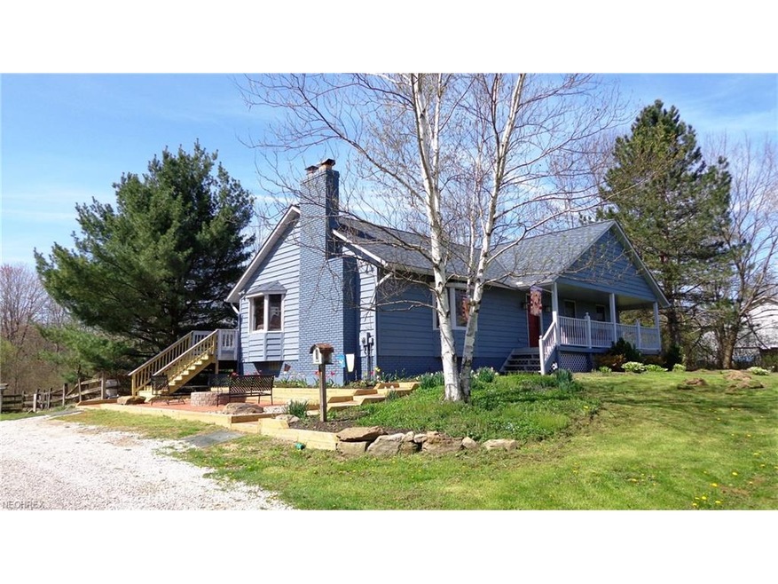 Covered front porch, newer roof, patio and steps.