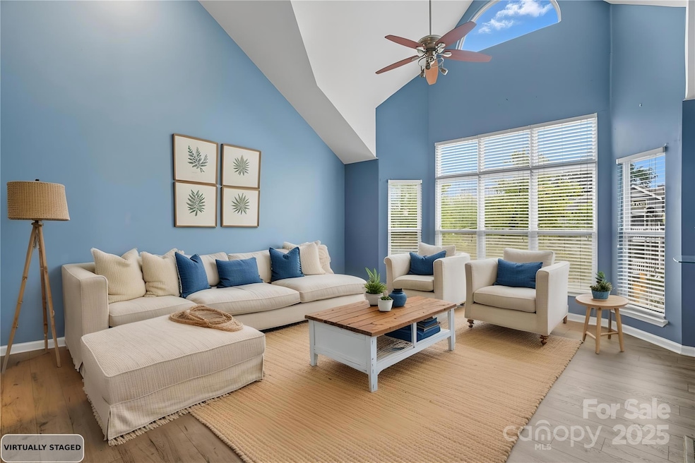 Soaring ceilings in the great room. *virtually staged*