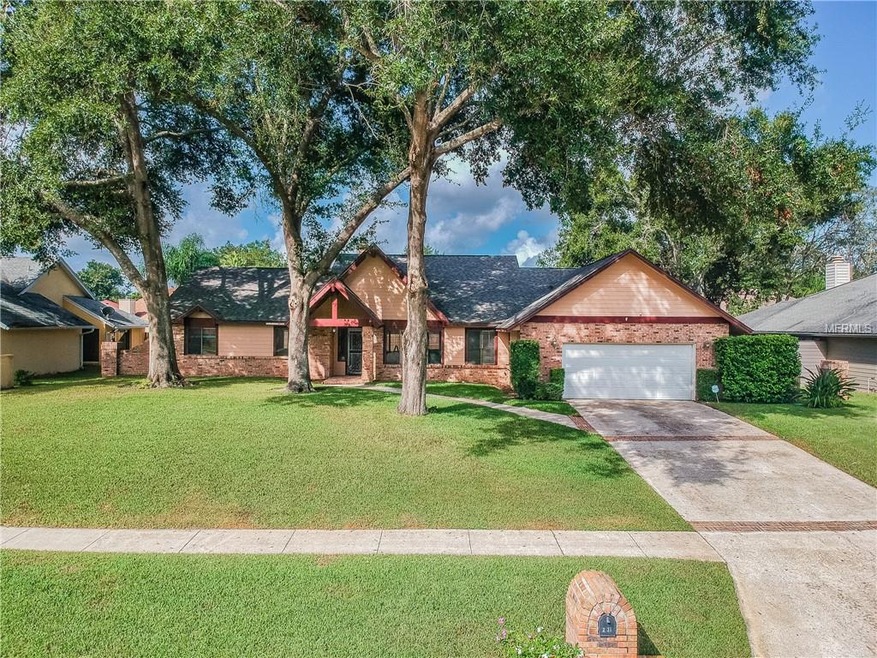 Three mature oak trees in the front yard.  Manicur