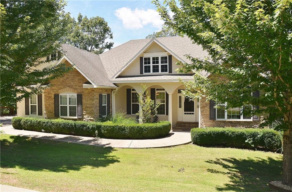 Gorgeous landscaping and a relaxing covered porch in the front of the home.