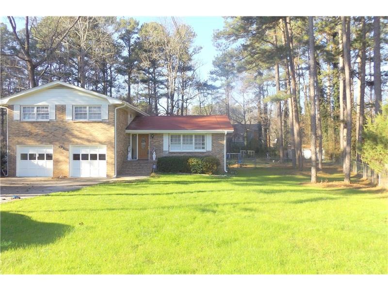 FRONT OF PROPERTY WITH LEVEL DRIVEWAY AND GREAT PL