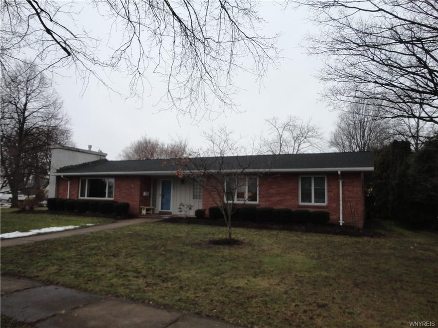 Front exterior, on West Ave.