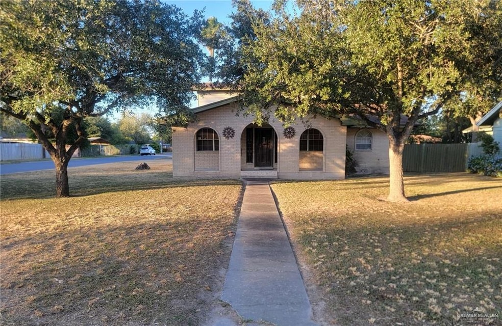 View of front of property featuring brick siding and covered porch