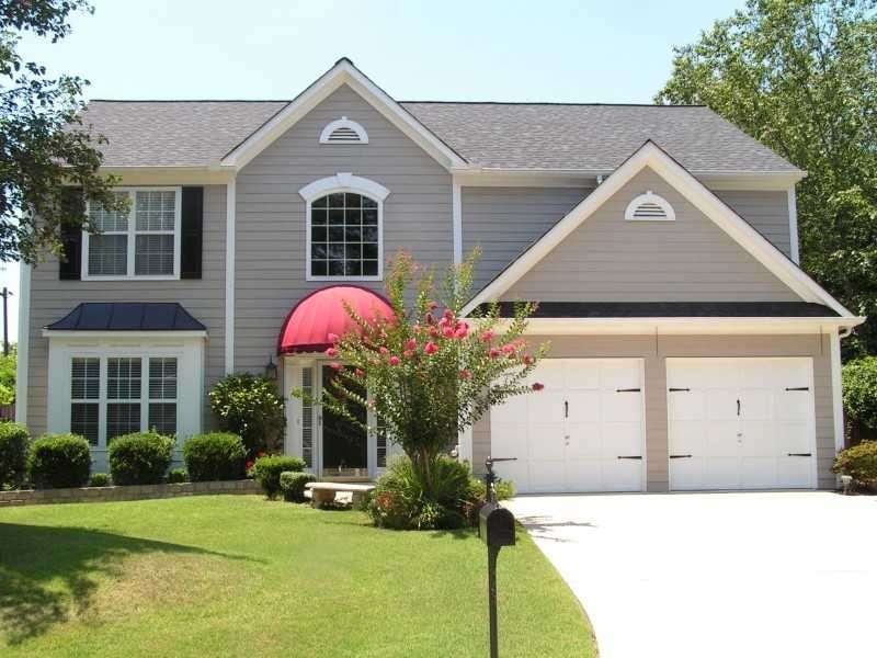 Exterior Front. Huge, private corner lot.