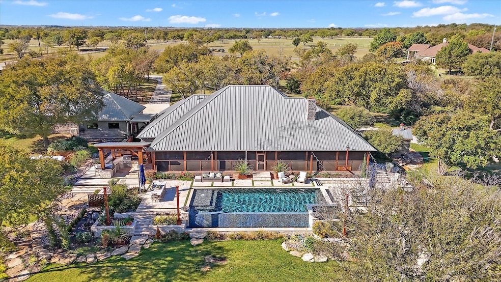 Outdoor pool with a patio area, a sunroom, and an outdoor living space
