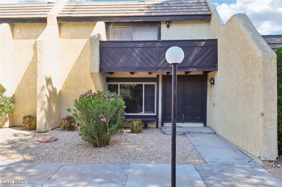 Doorway to property with stucco siding