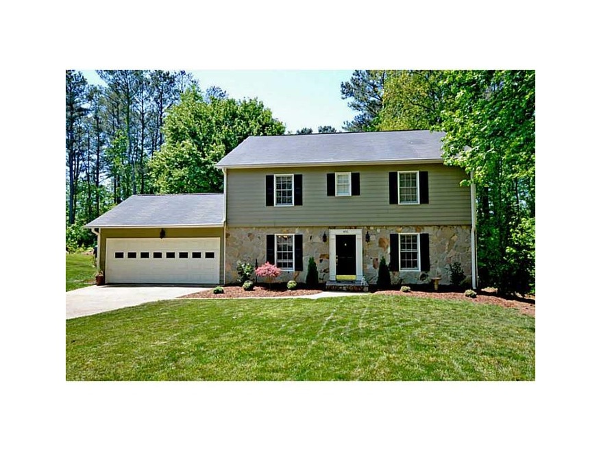 Exterior Front. Flat, landscaped front yard