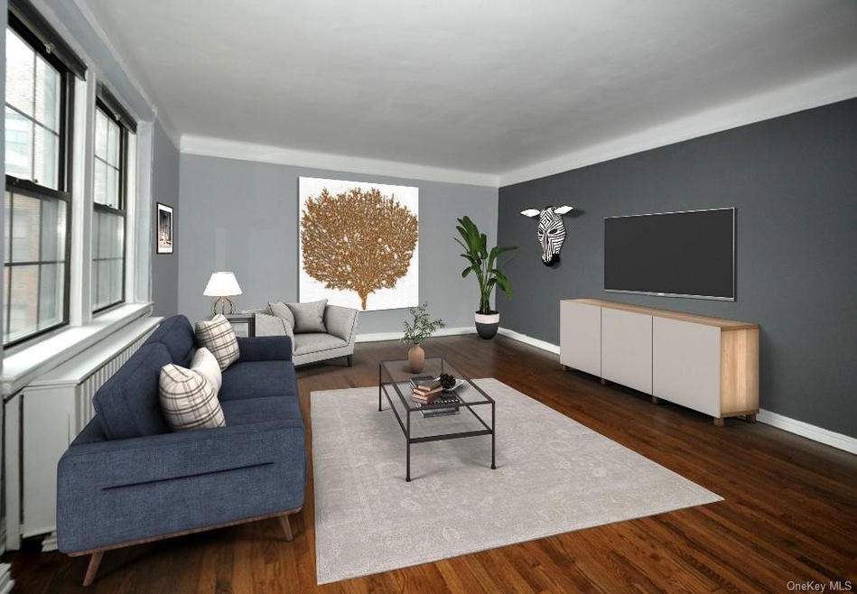 Large living room has refinished hardwood floors, 