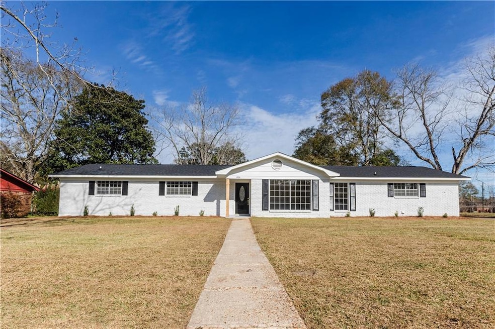 Single story home featuring a front yard