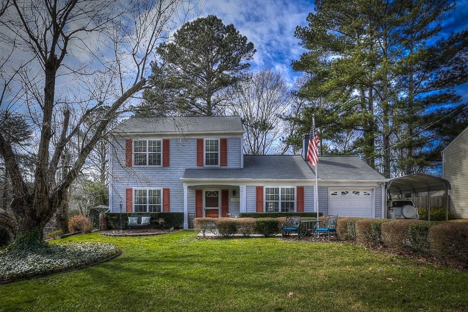 Front of home.  Level front yard!  covered porch. 