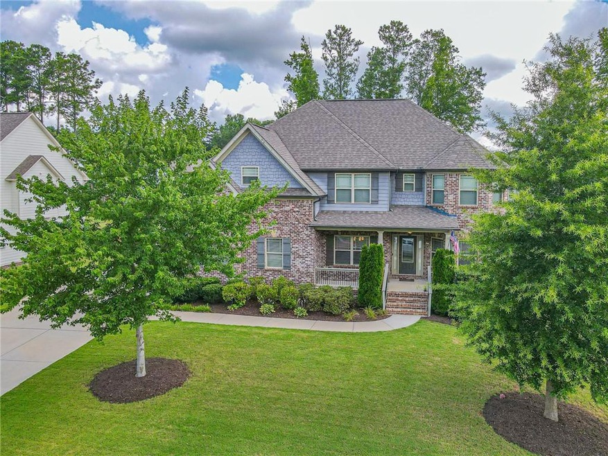 Craftsman inspired home featuring covered porch an